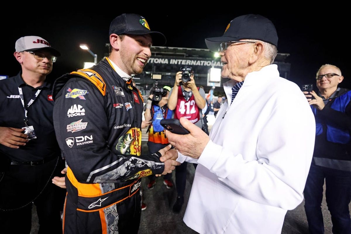 Feb 12, 2025; Daytona Beach, Florida, USA; NASCAR Cup Series driver Chase Briscoe (19) celebrates with team owner Joe Gibbs after winning the pole during qualifying for the Daytona 500 at Daytona International Speedway. Mandatory Credit: Peter Casey-Imagn Images