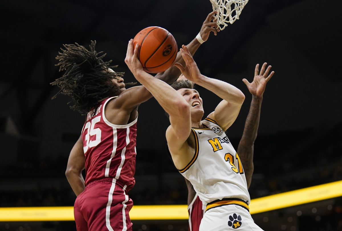 Feb 12, 2025; Columbia, Missouri, USA; Missouri Tigers guard Caleb Grill (31) shoots against Oklahoma Sooners forward Glenn Taylor Jr. (35) and forward Jalon Moore (14) during the first half at Mizzou Arena. Mandatory Credit: Jay Biggerstaff-Imagn Images