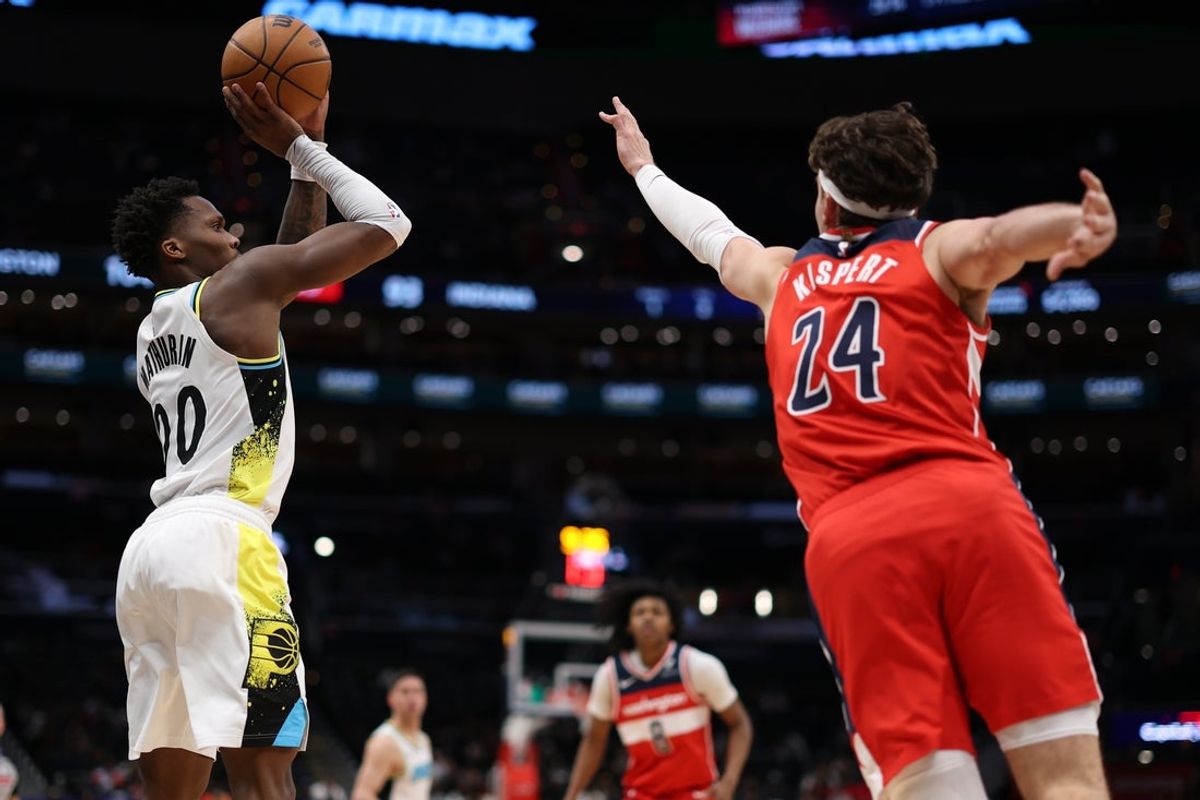 Feb 12, 2025; Washington, District of Columbia, USA; Indiana Pacers guard Bennedict Mathurin (00) shoots the ball as Washington Wizards forward Corey Kispert (24) defends in the fourth quarter at Capital One Arena. Mandatory Credit: Geoff Burke-Imagn Images