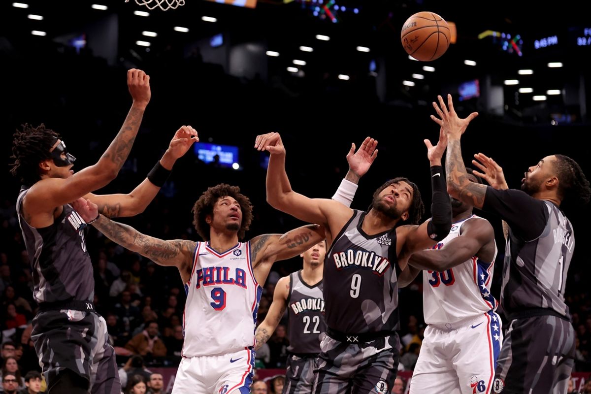 Feb 12, 2025; Brooklyn, New York, USA; Philadelphia 76ers guard Kelly Oubre Jr. (9) and center Adem Bona (30) fight for a rebound against Brooklyn Nets center Nic Claxton (33) and forward Trendon Watford (9) and guard D'Angelo Russell (1) during the fourth quarter at Barclays Center. Mandatory Credit: Brad Penner-Imagn Images