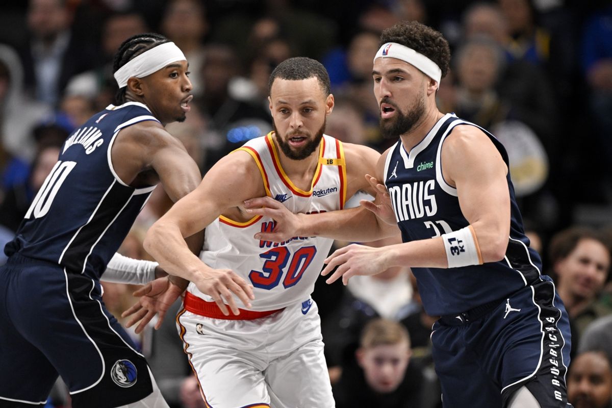 Feb 12, 2025; Dallas, Texas, USA; Golden State Warriors guard Stephen Curry (30) and Dallas Mavericks guard Klay Thompson (31) look for the ball during the second quarter at the American Airlines Center. Mandatory Credit: Jerome Miron-Imagn Images