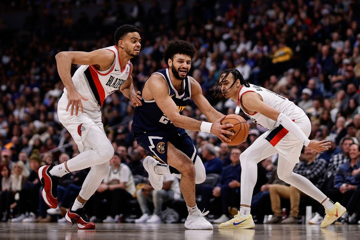 Feb 12, 2025; Denver, Colorado, USA; Denver Nuggets guard Jamal Murray (27) controls the ball under pressure from Portland Trail Blazers guard Rayan Rupert (21) and guard Dalano Banton (5) in the third quarter at Ball Arena. Mandatory Credit: Isaiah J. Downing-Imagn Images