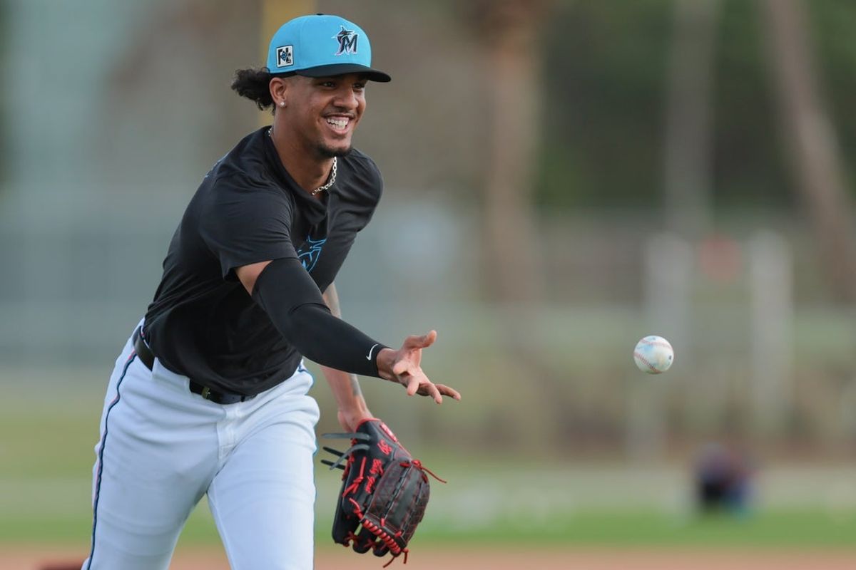 Feb 13, 2025; Jupiter, FL, USA; Miami Marlins starting pitcher Eury Perez (39) tosses the baseball to first base during a spring training workout at the Miami Marlins player development & scouting complex. Mandatory Credit: Sam Navarro-Imagn Images