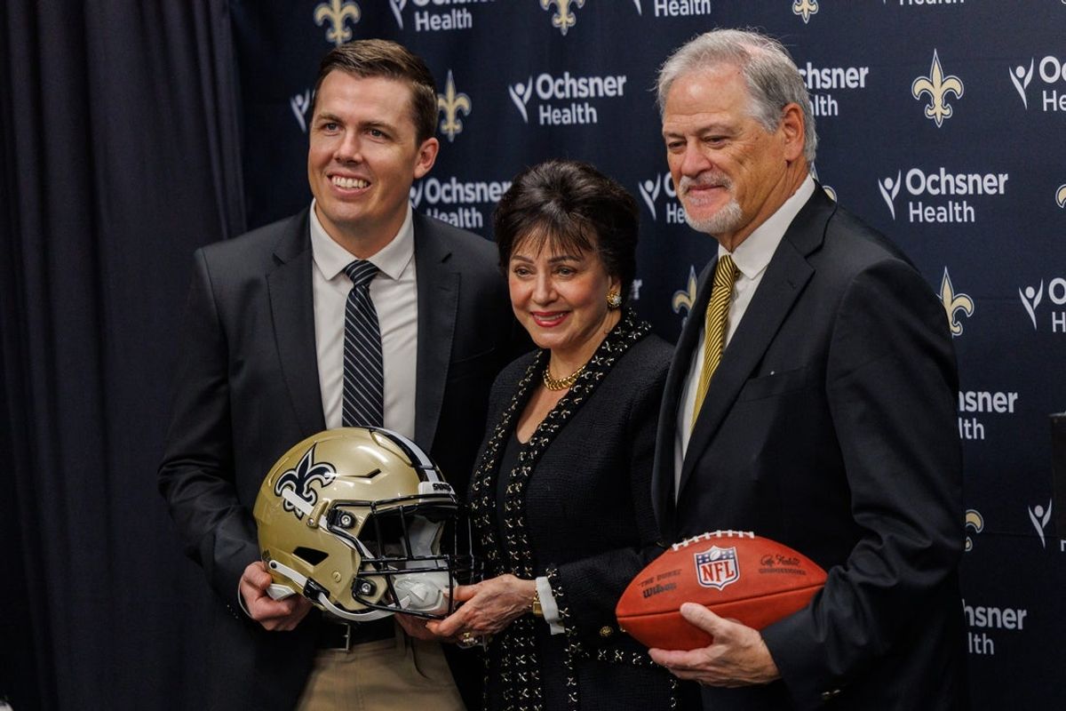 Feb 13, 2025; New Orleans, LA, USA;  New Orleans Saints owner Gayle Benson poses with head coach Kellen Moore and general manager Mickey Loomis at Ochsner Sports Performance Center. Mandatory Credit: Stephen Lew-Imagn Images