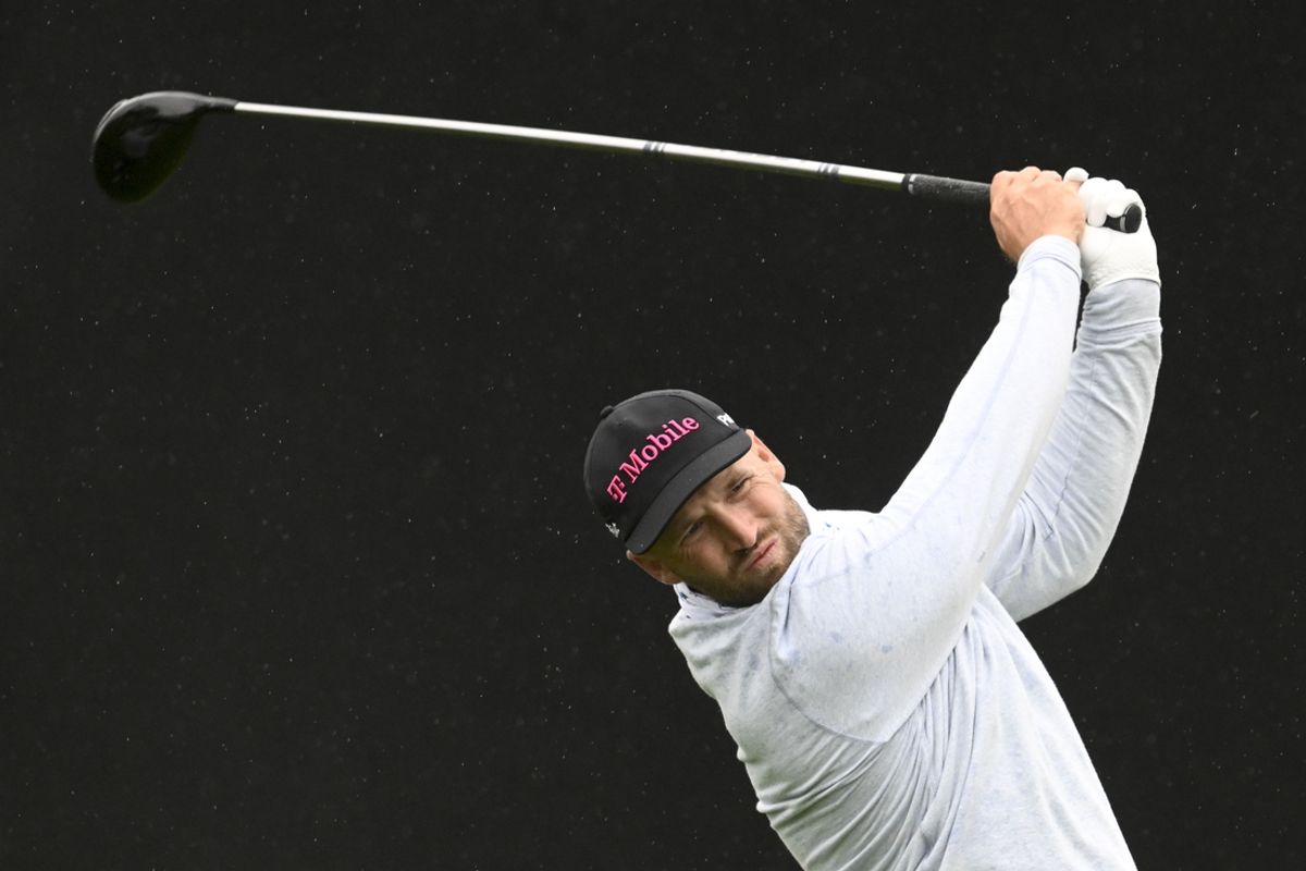 Feb 13, 2025; San Diego, California, USA; Wyndham Clark hits his tee shot on the seventh hole during the first round of The Genesis Invitational golf tournament at Torrey Pines. Mandatory Credit: Denis Poroy-Imagn Images