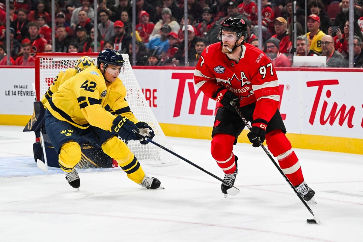 Feb 12, 2025; Montreal, Quebec, CAN; [Imagn Images direct customers only] Team Canada forward Connor McDavid (97) plays the puck against Team Sweden defenseman Gustav Forsling (42) in the first period during a 4 Nations Face-Off ice hockey game at Bell Centre. Mandatory Credit: David Kirouac-Imagn Images
