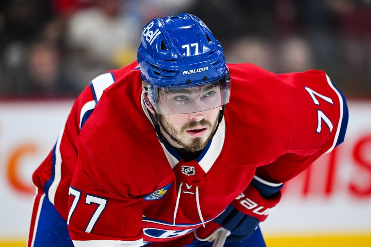 Feb 8, 2025; Montreal, Quebec, CAN; Montreal Canadiens center Kirby Dach (77) waits for a face-off against the New Jersey Devils during the second period at Bell Centre. Mandatory Credit: David Kirouac-Imagn Images