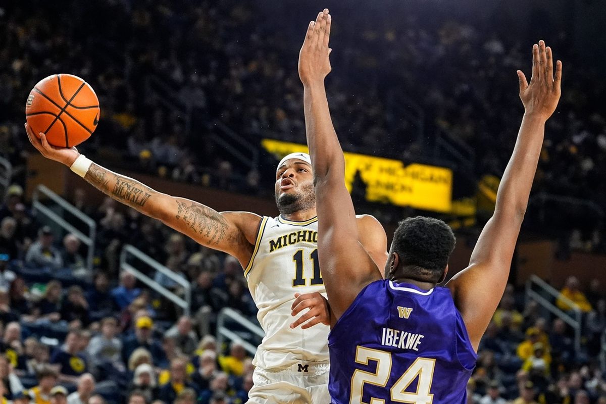 Michigan guard Roddy Gayle Jr. makes a layup against Washington center KC Ibekwe during the second half at Crisler Center in Ann Arbor on Sunday, Jan. 12, 2025.