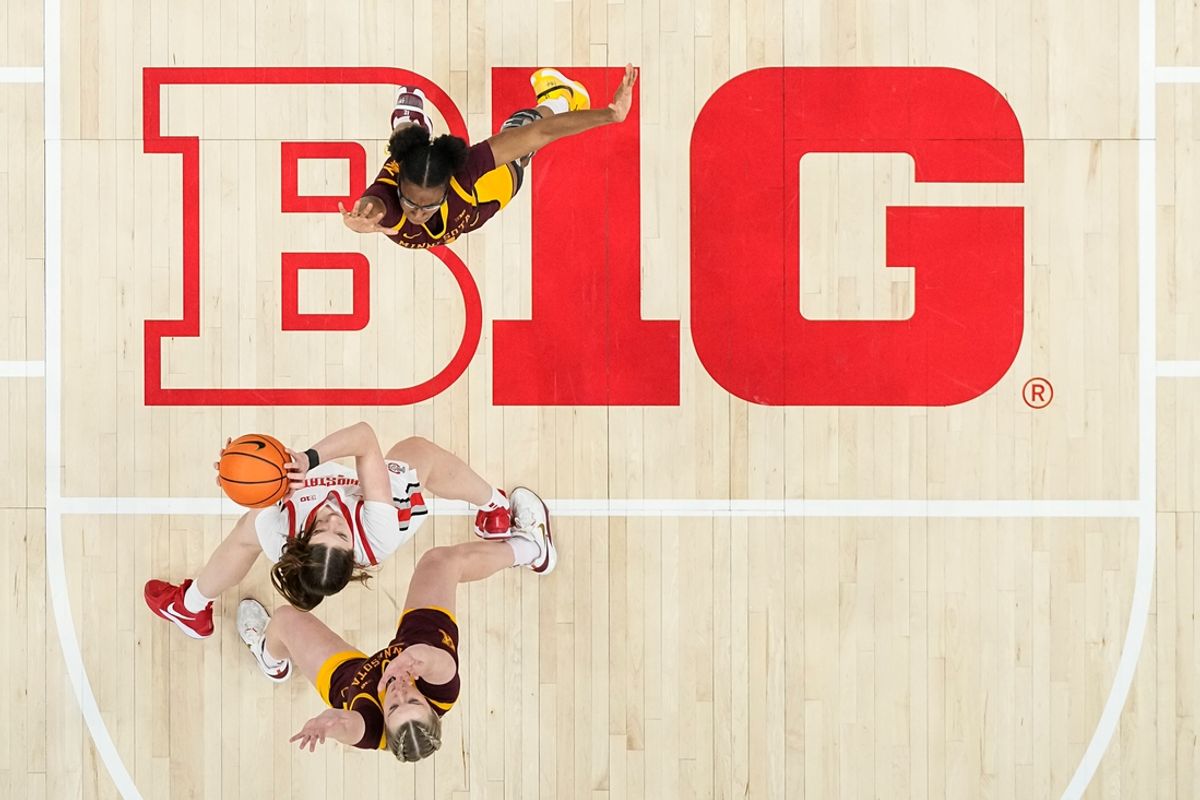 Ohio State Buckeyes center Elsa Lemmila (12) catches an inbounds pass between Minnesota Golden Gophers forward Mallory Heyer (24) and Minnesota Golden Gophers forward Niamya Holloway (41) during the NCAA women's basketball game at Value City Arena in Columbus on Feb. 13, 2025. Ohio State won 87-84.