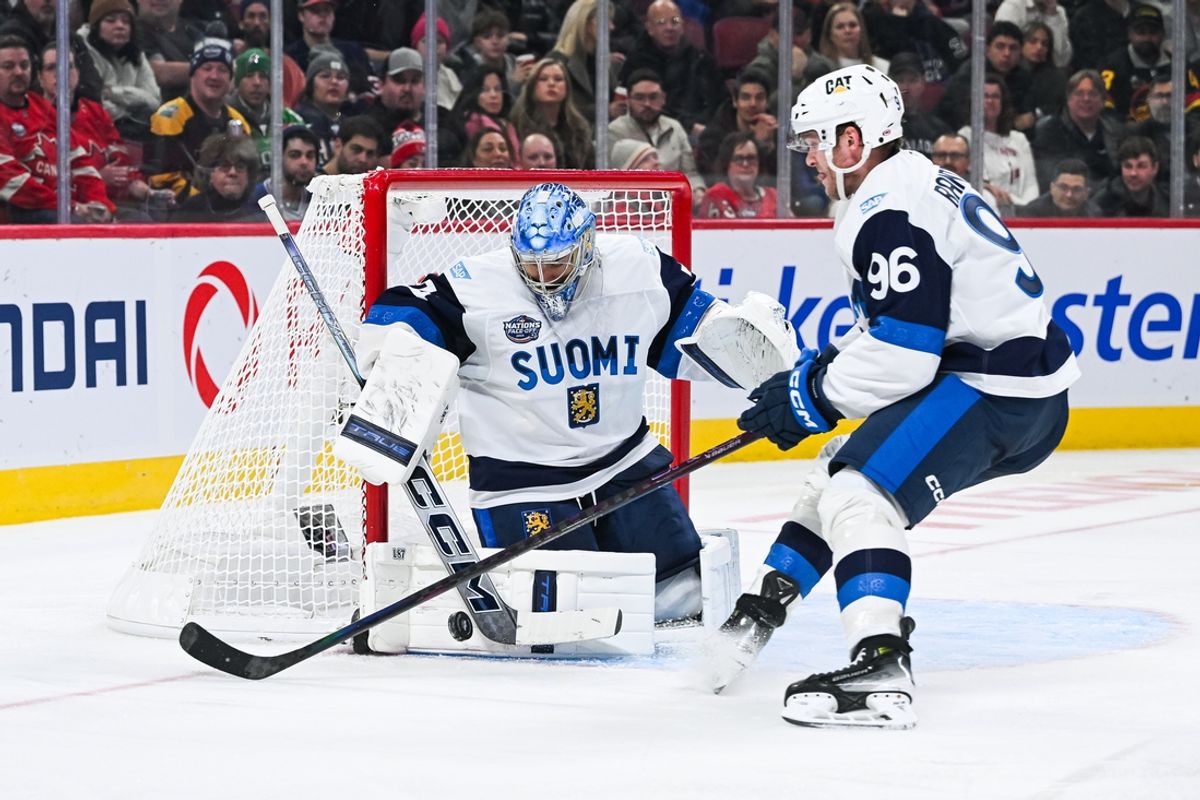 Feb 13, 2025; Montreal, Quebec, CAN; [Imagn Images direct customers only] Team Finland goalie Juuse Saros (74) makes a save near forward Mikko Rantanen (96) against Team USA in the third period during a 4 Nations Face-Off ice hockey game at Bell Centre. Mandatory Credit: David Kirouac-Imagn Images