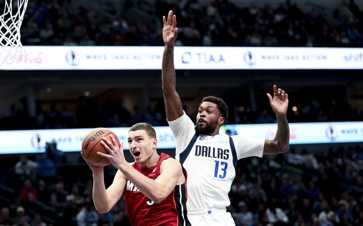 Feb 13, 2025; Dallas, Texas, USA;  Miami Heat forward Nikola Jovic (5) shoots past Dallas Mavericks forward Naji Marshall (13) during the second half at American Airlines Center. Mandatory Credit: Kevin Jairaj-Imagn Images