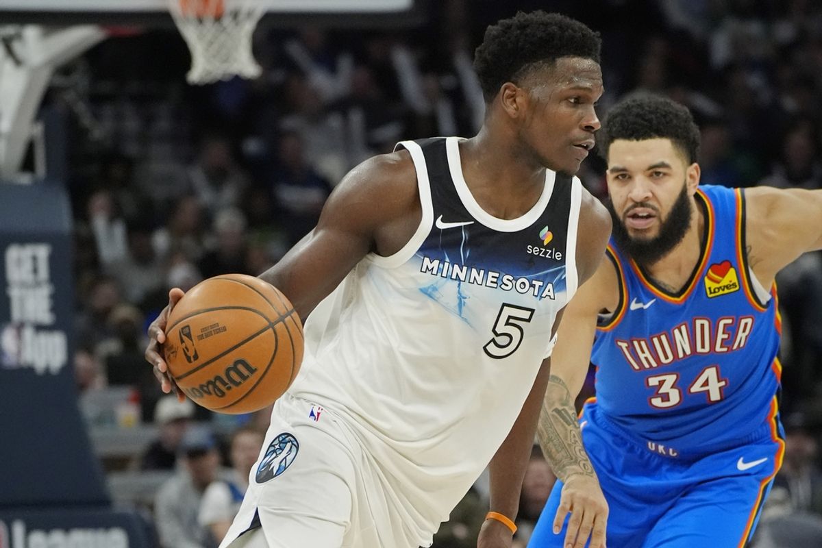 Feb 13, 2025; Minneapolis, Minnesota, USA; Minnesota Timberwolves guard Anthony Edwards (5) works past Oklahoma City Thunder guard Kenrich Williams (34) in the fourth quarter at Target Center. Mandatory Credit: Bruce Kluckhohn-Imagn Images