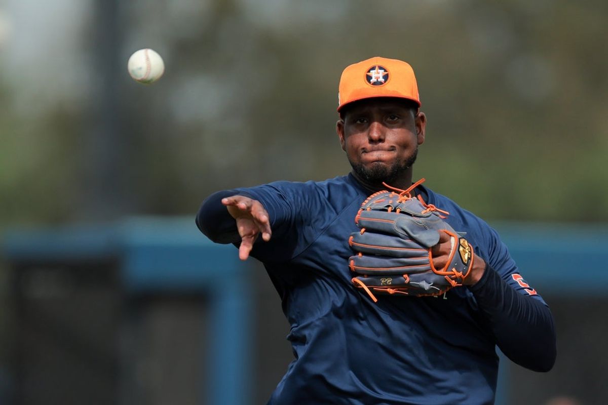 Feb 14, 2025; West Palm Beach, FL, USA; Houston Astros starting pitcher Ronel Blanco (56) works on a fielding exercise during a spring training workout at CACTI Park of the Palm Beaches. Mandatory Credit: Sam Navarro-Imagn Images