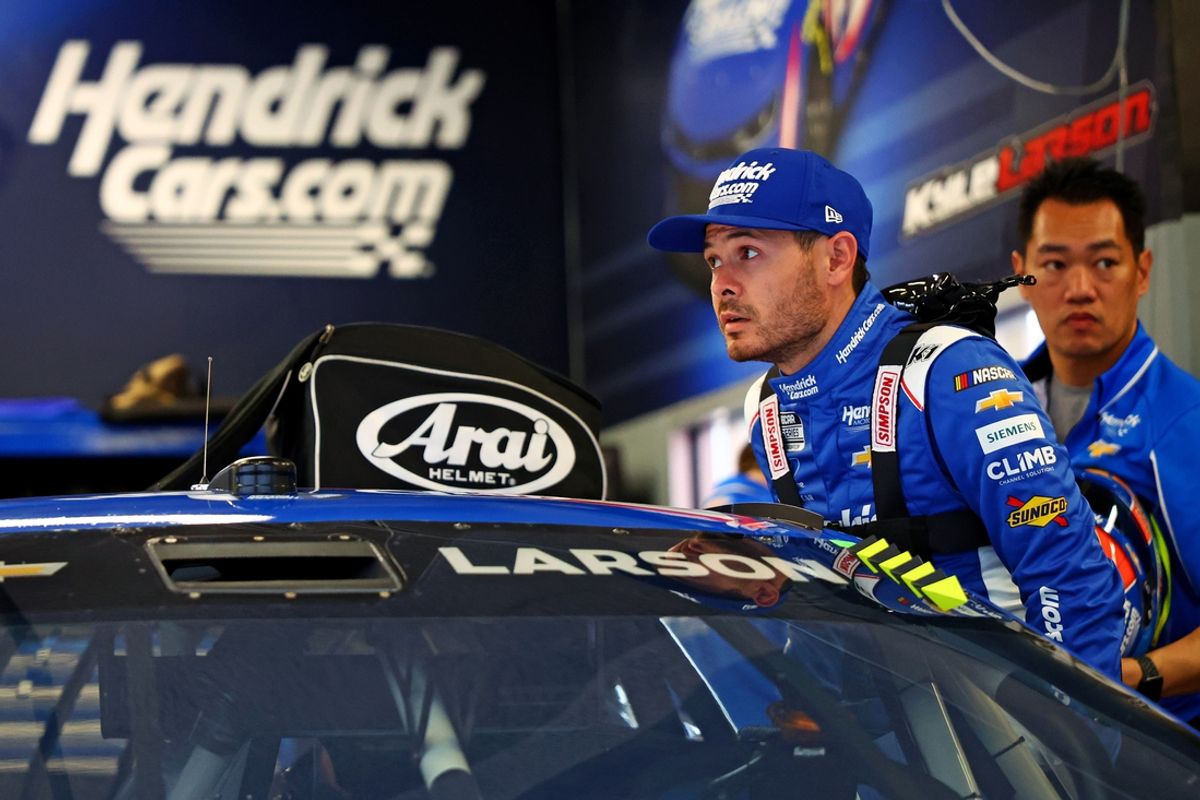 Feb 14, 2025; Daytona Beach, Florida, USA; NASCAR Cup Series driver Kyle Larson (5) gets into his car during practice for the Daytona 500 at Daytona International Speedway. Mandatory Credit: Peter Casey-Imagn Images