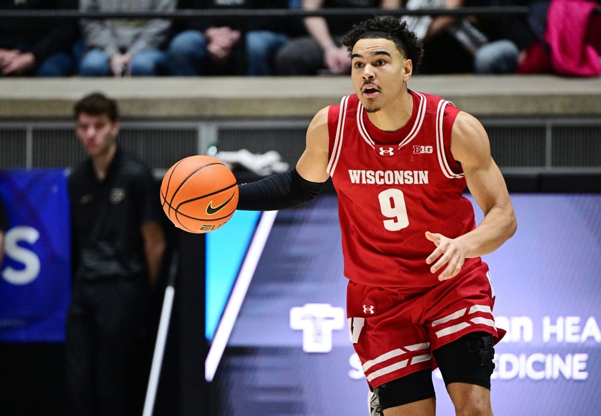 Feb 15, 2025; West Lafayette, Indiana, USA; Wisconsin Badgers guard John Tonje (9) dribbles the ball down the court during the first half against the Purdue Boilermakers at Mackey Arena. Mandatory Credit: Marc Lebryk-Imagn Images