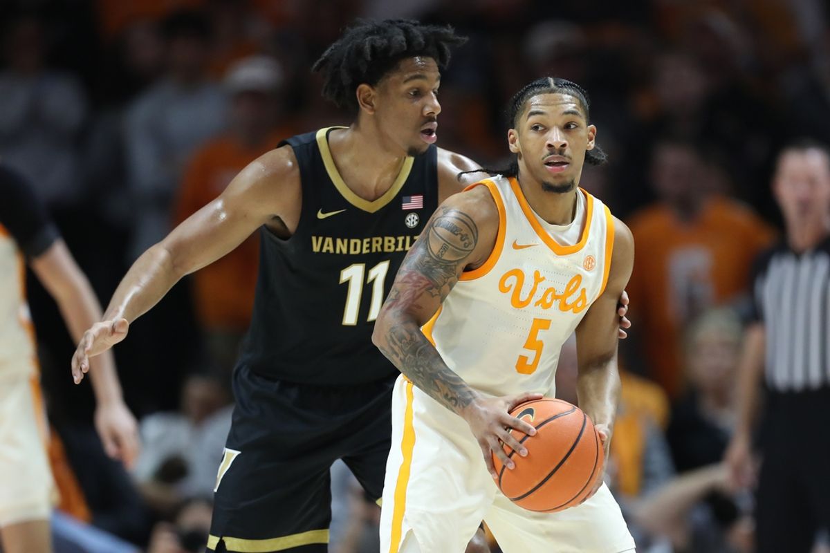 Feb 15, 2025; Knoxville, Tennessee, USA; Tennessee Volunteers guard Zakai Zeigler (5) looks to move the ball against Vanderbilt Commodores guard AJ Hoggard (11) during the first half at Thompson-Boling Arena at Food City Center. Mandatory Credit: Randy Sartin-Imagn Images