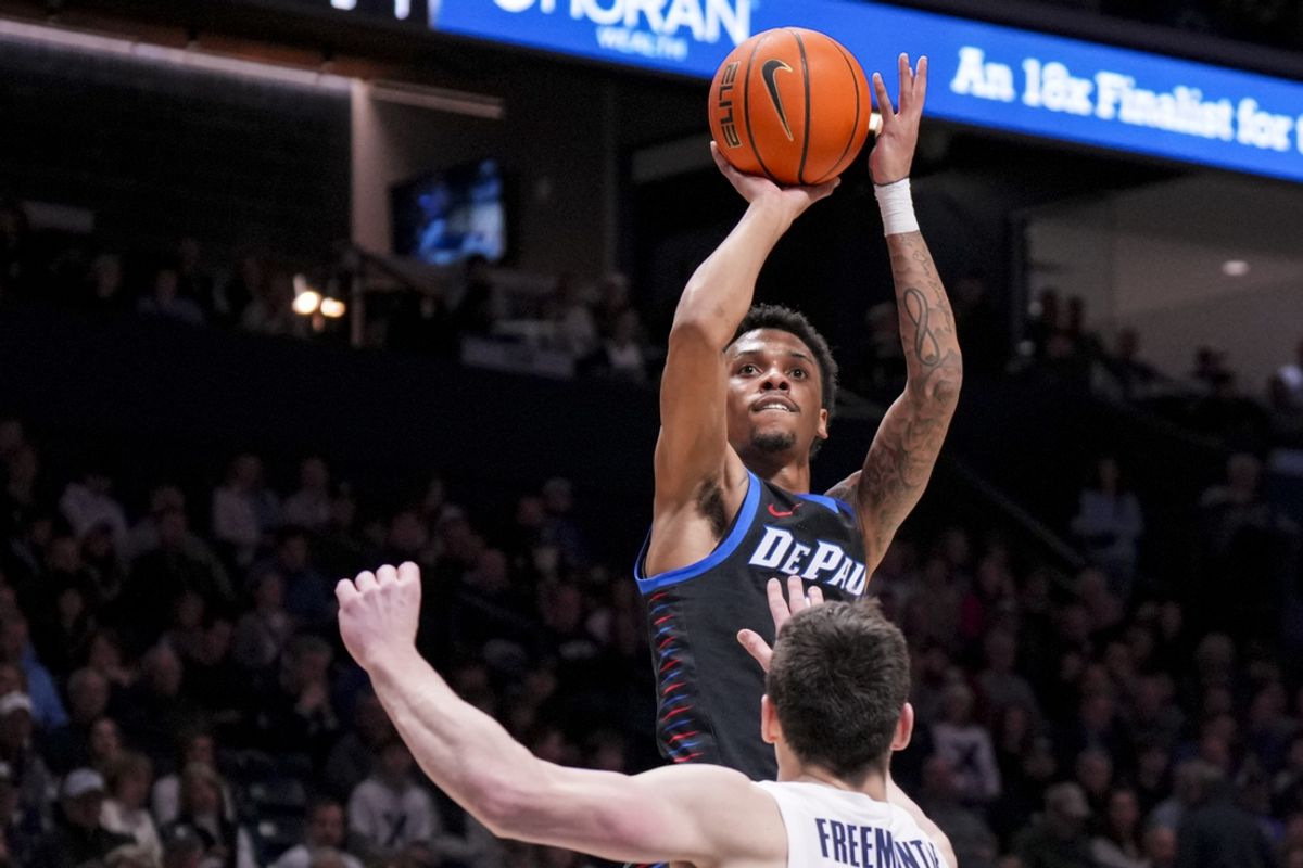 Feb 15, 2025; Cincinnati, Ohio, USA;  DePaul Blue Demons guard CJ Gunn (11) shoots against Xavier Musketeers forward Zach Freemantle (32) in the second half at the Cintas Center. Mandatory Credit: Aaron Doster-Imagn Images