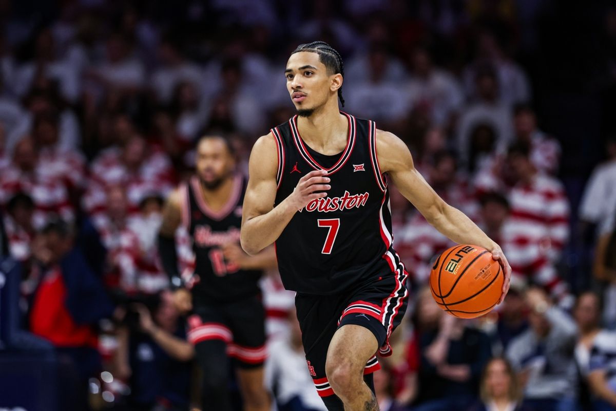 Feb 15, 2025; Tucson, Arizona, USA; Houston Cougars guard Milos Uzan (7) dribbles the ball during the first half against the Arizona Wildcats at McKale Center. Mandatory Credit: Aryanna Frank-Imagn Images