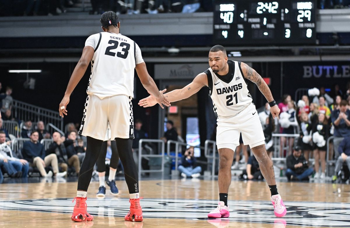 Feb 15, 2025; Indianapolis, Indiana, USA; Butler Bulldogs center Andre Screen (23) and Butler Bulldogs forward Pierre Brooks II (21) celebrate after a play during the first half against the Georgetown Hoyas at Hinkle Fieldhouse. Mandatory Credit: Robert Goddin-Imagn Images