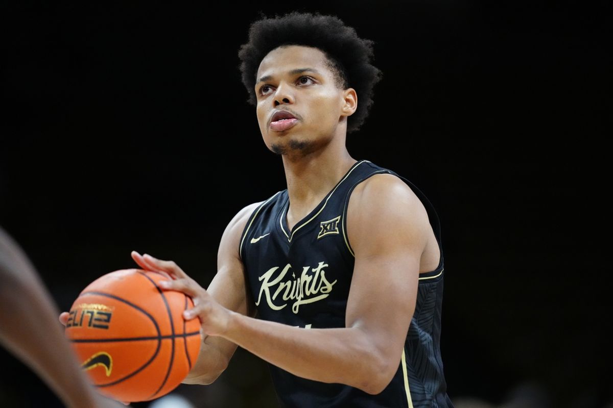 Feb 15, 2025; Boulder, Colorado, USA; UCF Knights guard Keyshawn Hall (4) warms up before the game against the Colorado Buffaloes at the CU Events Center. Mandatory Credit: Ron Chenoy-Imagn Images