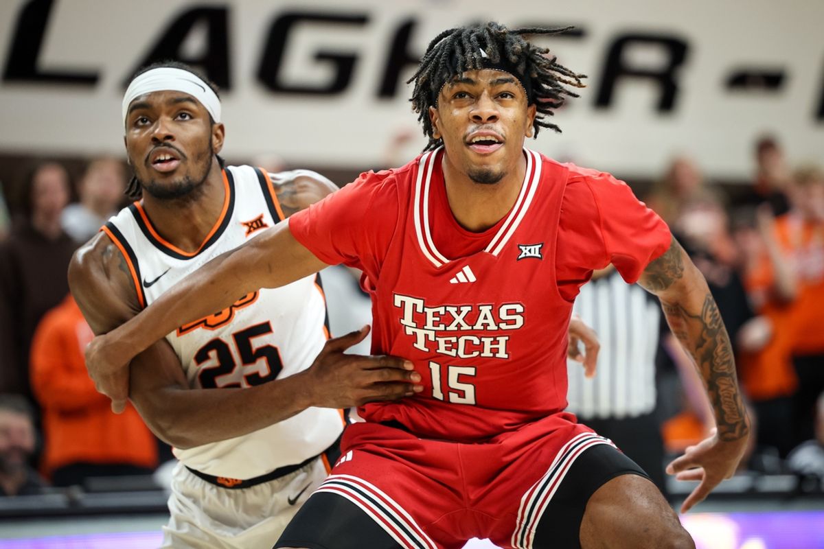 Feb 15, 2025; Stillwater, Oklahoma, USA; Texas Tech Red Raiders forward JT Toppin (15) blocks out Oklahoma State Cowboys forward Robert Jennings II (25) during the first half at Gallagher-Iba Arena. Mandatory Credit: William Purnell-Imagn Images