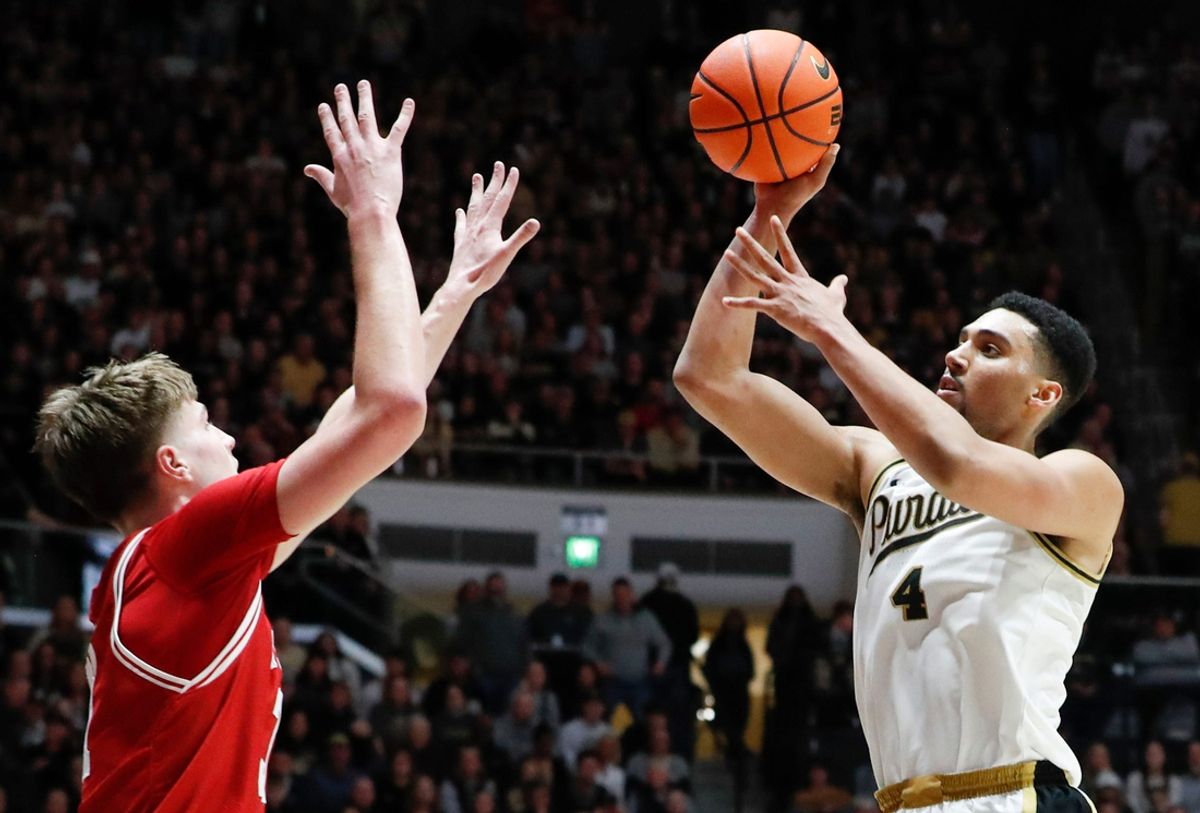Wisconsin Badgers forward Nolan Winter (31) defends the shot of Purdue Boilermakers forward Trey Kaufman-Renn (4) Saturday, Feb. 15, 2025, during the NCAA men’s basketball game at Mackey Arena in West Lafayette, Ind. Wisconsin Badgers won 94-84.