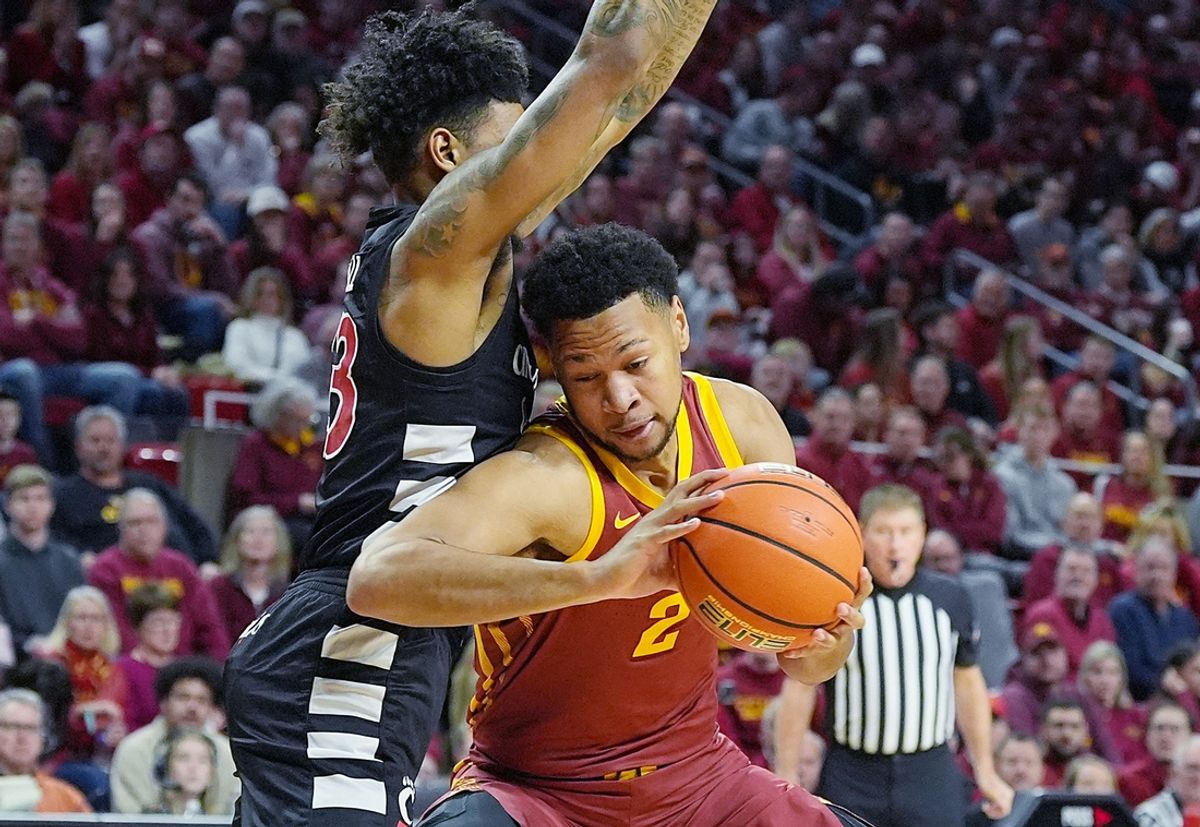 Iowa State Cyclones forward Joshua Jefferson (2) drives to the basket around Cincinnati Bearcats' forward Dillon Mitchell (23) during the first half in the Big-12 men’s basketball at Hilton Coliseum on Feb. 15, 2025 in Ames, Iowa.