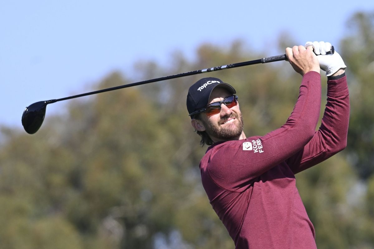 Feb 15, 2025; San Diego, California, USA; Patrick Rodgers hits his tee shot on the second hole during the third round of The Genesis Invitational golf tournament at Torrey Pines. Mandatory Credit: Denis Poroy-Imagn Images