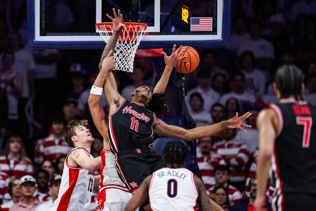 Feb 15, 2025; Tucson, Arizona, USA; Arizona Wildcats forward Carter Bryant (9) and Houston Cougars forward Joseph Tugler (11) both reach to rebound the ball during the second half at McKale Center. Mandatory Credit: Aryanna Frank-Imagn Images