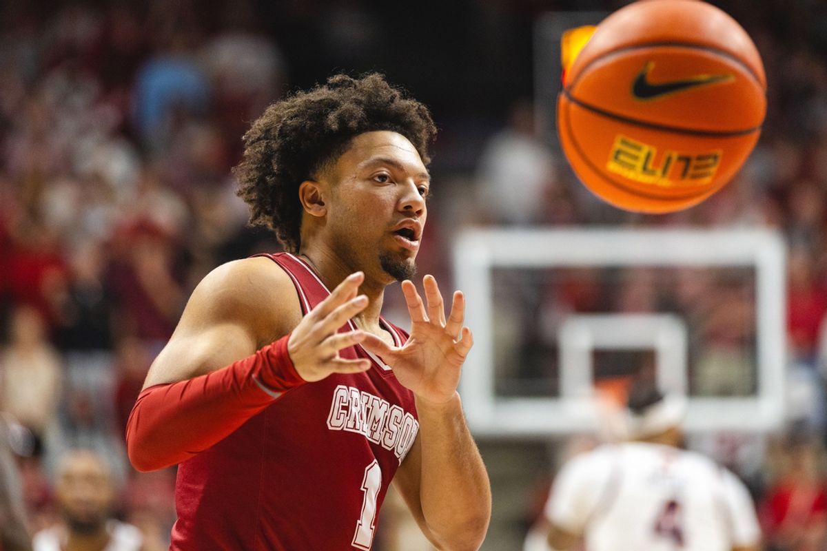 Feb 15, 2025; Tuscaloosa, Alabama, USA; Alabama Crimson Tide guard Mark Sears (1) receives the ball against the Auburn Tigers during the first half at Coleman Coliseum. Mandatory Credit: Will McLelland-Imagn Images