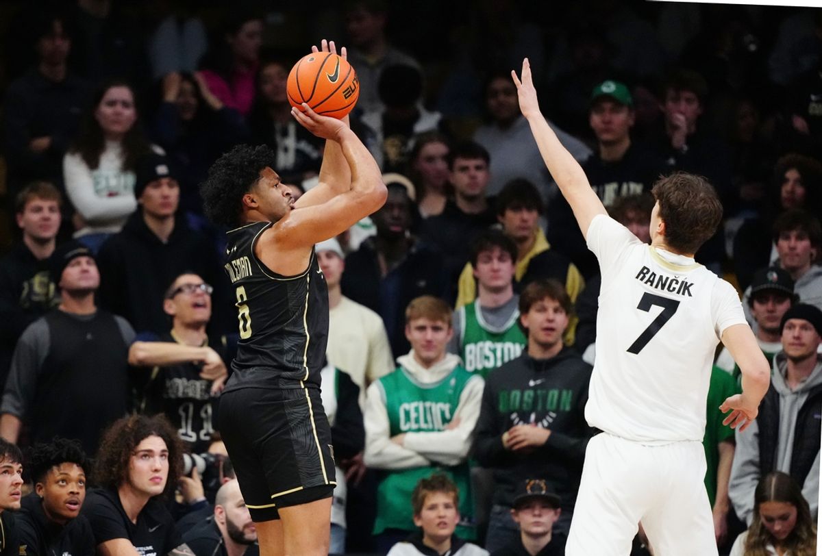 Feb 15, 2025; Boulder, Colorado, USA; UCF Knights guard Dallan Coleman (6) shoots the ball over Colorado Buffaloes forward Sebastian Rancik (7) in the second half at the CU Events Center. Mandatory Credit: Ron Chenoy-Imagn Images