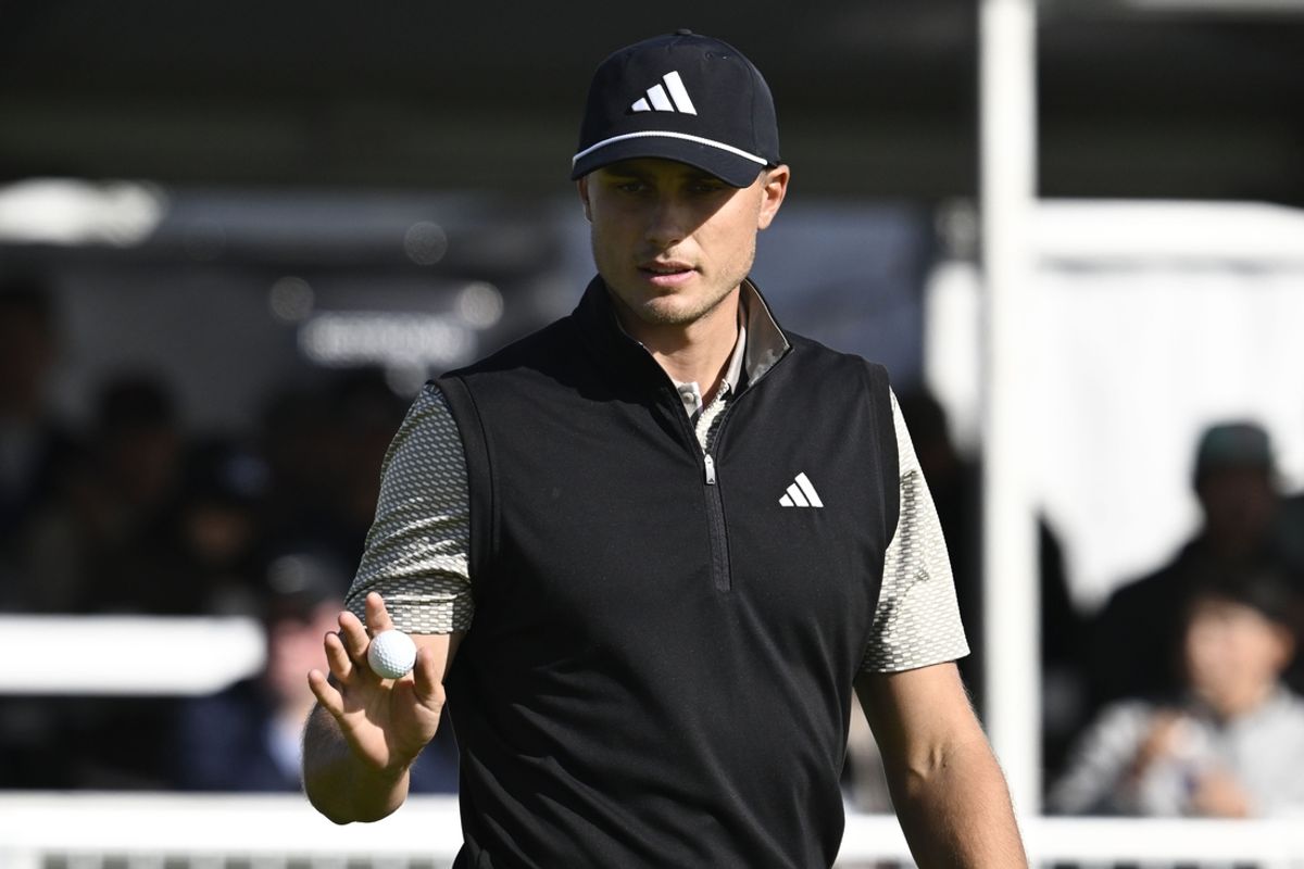 Feb 15, 2025; San Diego, California, USA; Ludvig Aberg holds up the ball after hitting a birdie putt on the 17th hole during the third round of The Genesis Invitational golf tournament at Torrey Pines. Mandatory Credit: Denis Poroy-Imagn Images