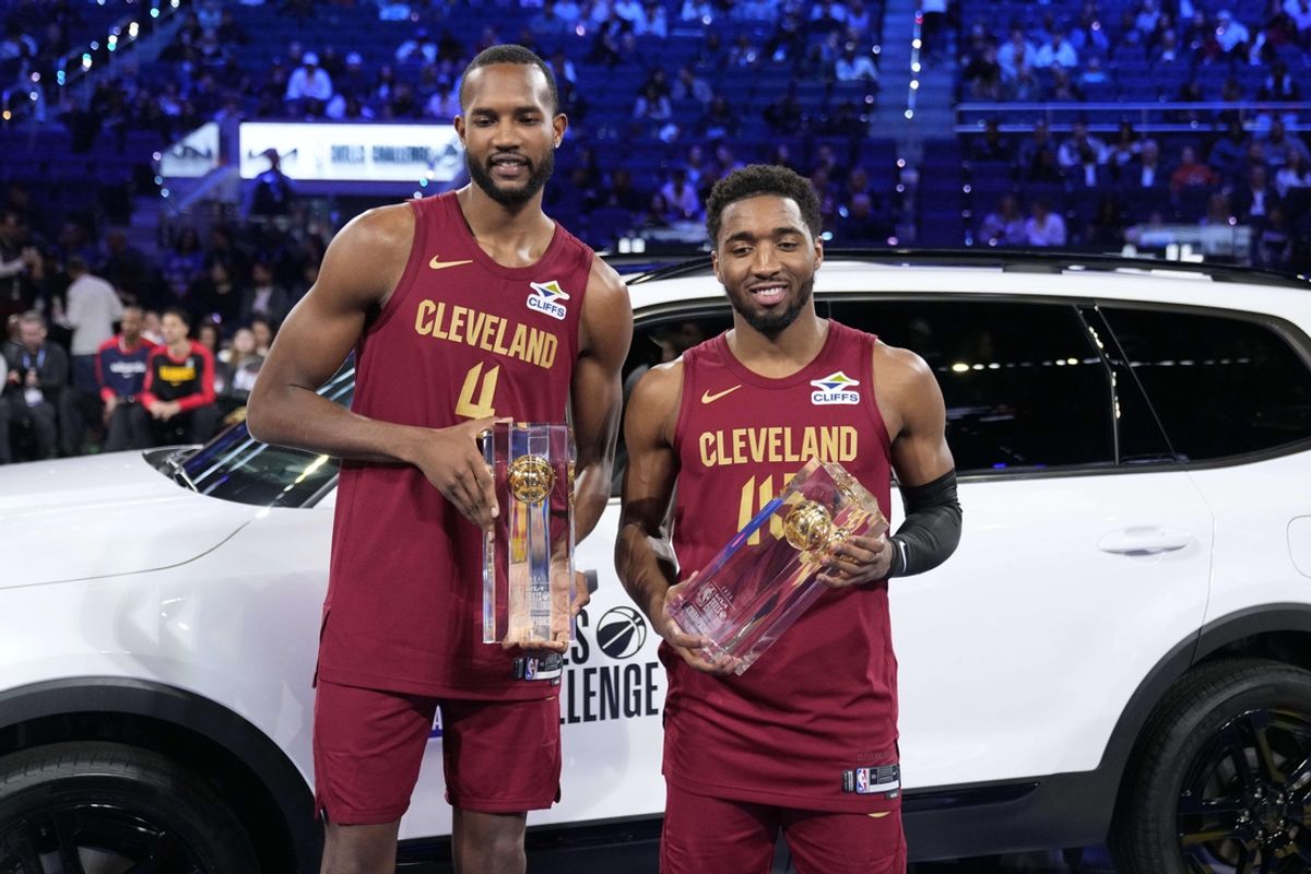 Feb 15, 2025; San Francisco, CA, USA; Team Cavs center Evan Mobley (4) and guard Donovan Mitchell (45) of the Cleveland Cavaliers celebrate with the trophies after winning the skills challenge during All Star Saturday Night ahead of the 2025 NBA All Star Game at Chase Center. Mandatory Credit: Kyle Terada-Imagn Images