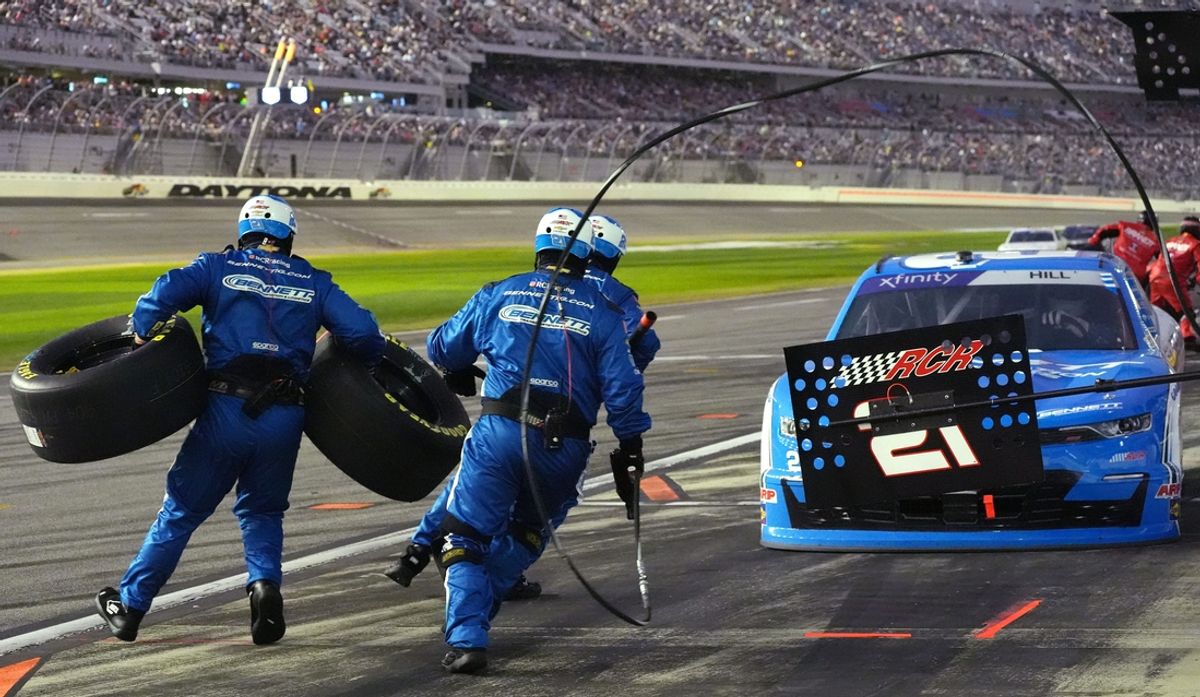 Pit crew members jump into action as Austin Hill brings the no. 21 in, Saturday February 15, 2025, during the United Rentals 300 at Daytona International Speedway