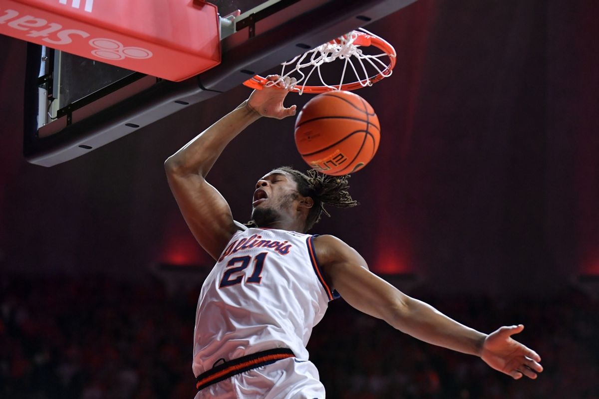 Feb 15, 2025; Champaign, Illinois, USA;  Illinois Fighting Illini forward Morez Johnson Jr. (21) dunks the ball during the first half against the Michigan State Spartans at State Farm Center. Mandatory Credit: Ron Johnson-Imagn Images