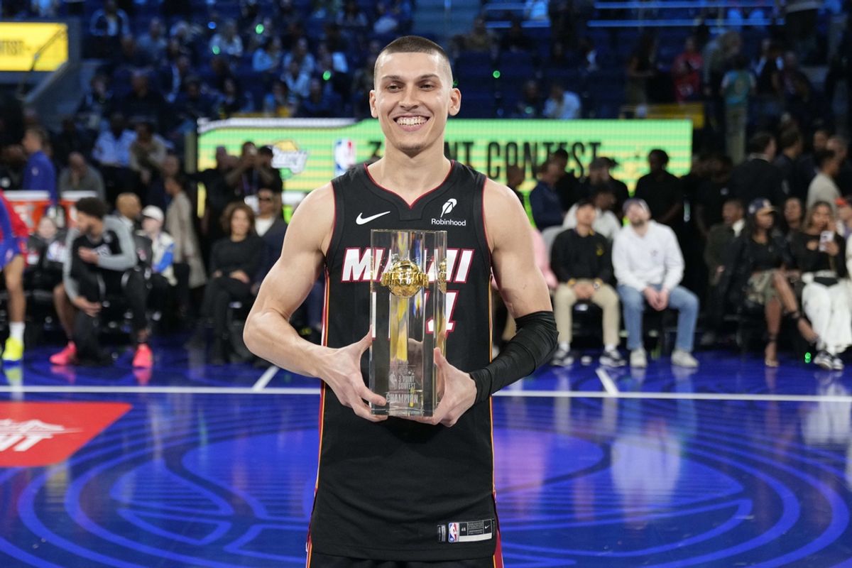 Feb 15, 2025; San Francisco, CA, USA; Miami Heat guard Tyler Herro (14) celebrates with the trophy after winning the three-point contest during All Star Saturday Night ahead of the 2025 NBA All Star Game at Chase Center. Mandatory Credit: Kyle Terada-Imagn Images