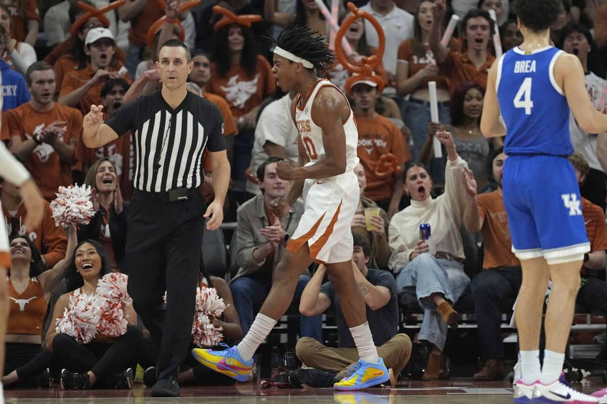 Feb 15, 2025; Austin, Texas, USA; Texas Longhorns guard Tre Johnson (20), the SEC's leading scorer, reacts after scoring during the second half against the Kentucky Wildcats at Moody Center. Mandatory Credit: Scott Wachter-Imagn Images
