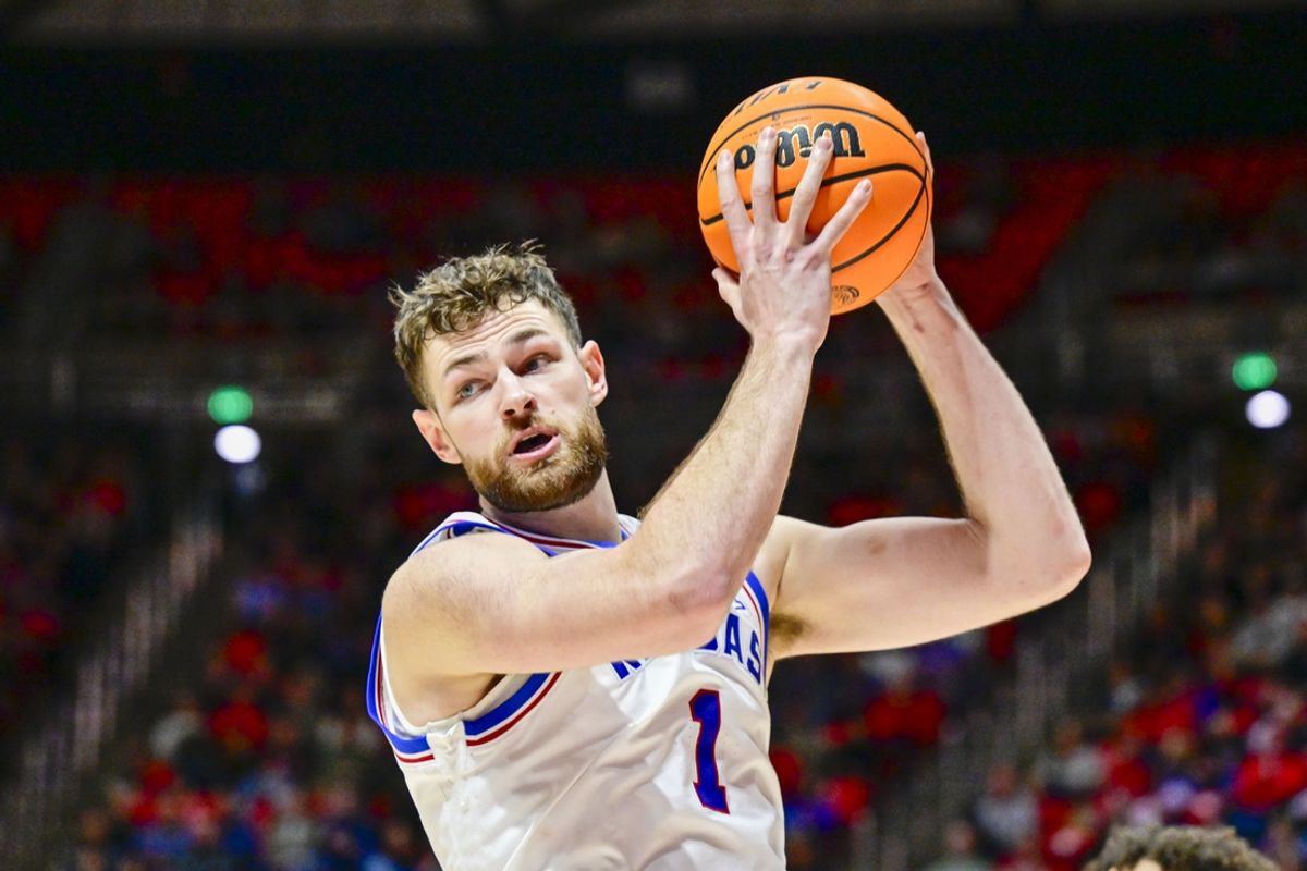 Feb 15, 2025; Salt Lake City, Utah, USA; Kansas Jayhawks center Hunter Dickinson (1) recovers a rebound against the Utah Utes during the second half at the Jon M. Huntsman Center. Mandatory Credit: Christopher Creveling-Imagn Images