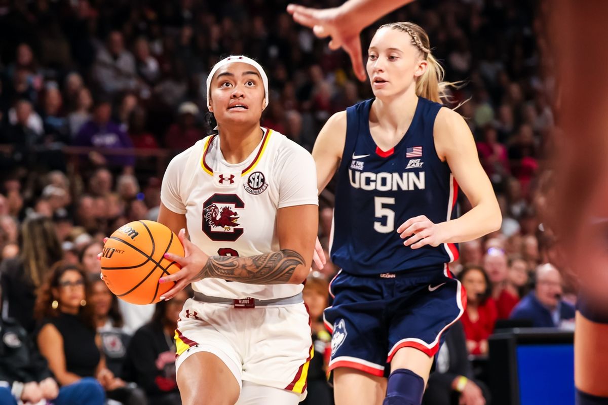 Feb 16, 2025; Columbia, South Carolina, USA; South Carolina Gamecocks guard Te-Hina Paopao (0) drives past UConn Huskies guard Paige Bueckers (5) in the first half at Colonial Life Arena. Mandatory Credit: Jeff Blake-Imagn Images