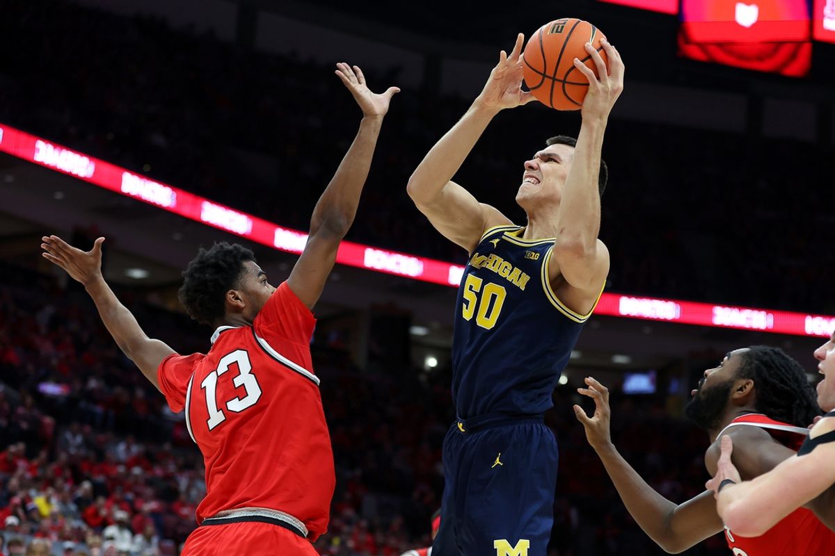 Feb 16, 2025; Columbus, Ohio, USA;  Michigan Wolverines center Vladislav Goldin (50) shoots the ball over Ohio State Buckeyes forward Sean Stewart (13) during the first half at Value City Arena. Mandatory Credit: Joseph Maiorana-Imagn Images