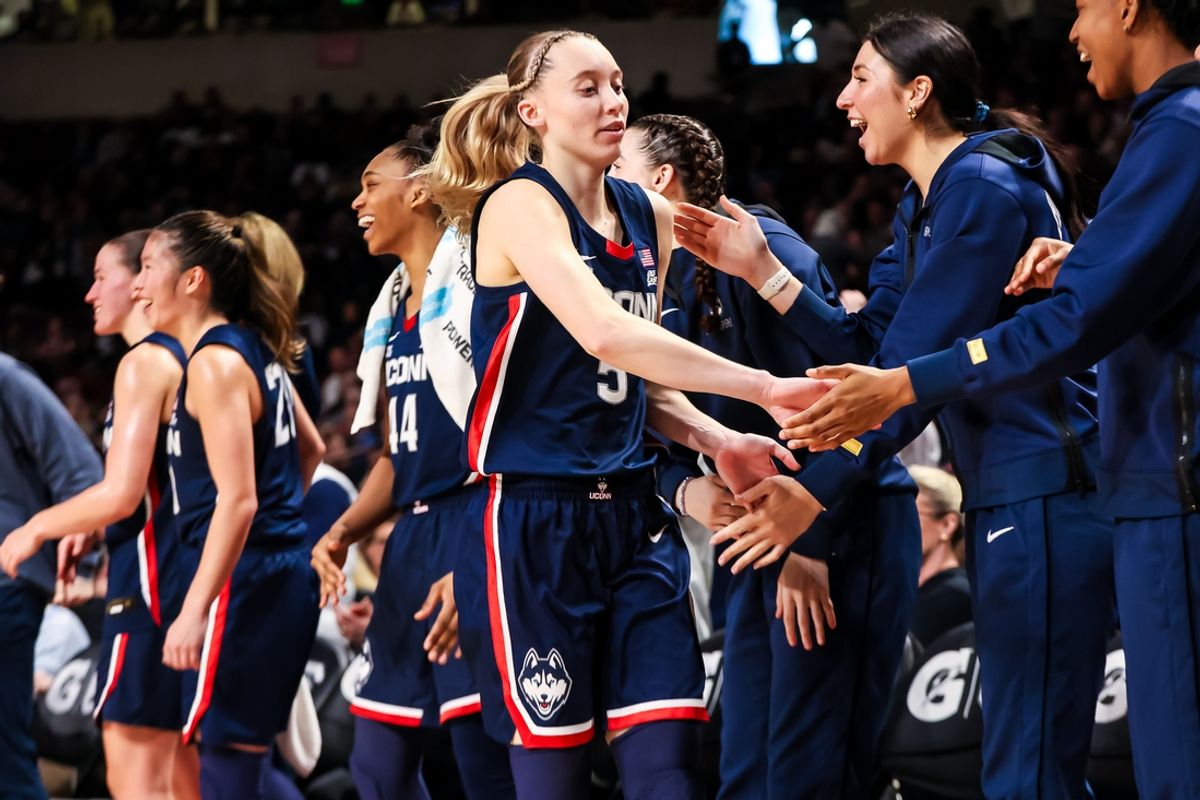 Feb 16, 2025; Columbia, South Carolina, USA; UConn Huskies guard Paige Bueckers (5) is congratulated after being pulled from the game against the South Carolina Gamecocks in the second half at Colonial Life Arena. Mandatory Credit: Jeff Blake-Imagn Images