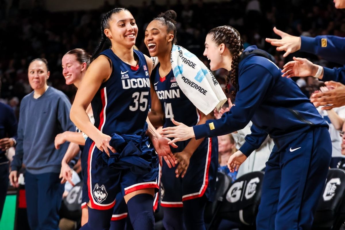 Feb 16, 2025; Columbia, South Carolina, USA; UConn Huskies guard Azzi Fudd (35) is congratulated after being pulled from the game against the South Carolina Gamecocks in the second half at Colonial Life Arena. Mandatory Credit: Jeff Blake-Imagn Images