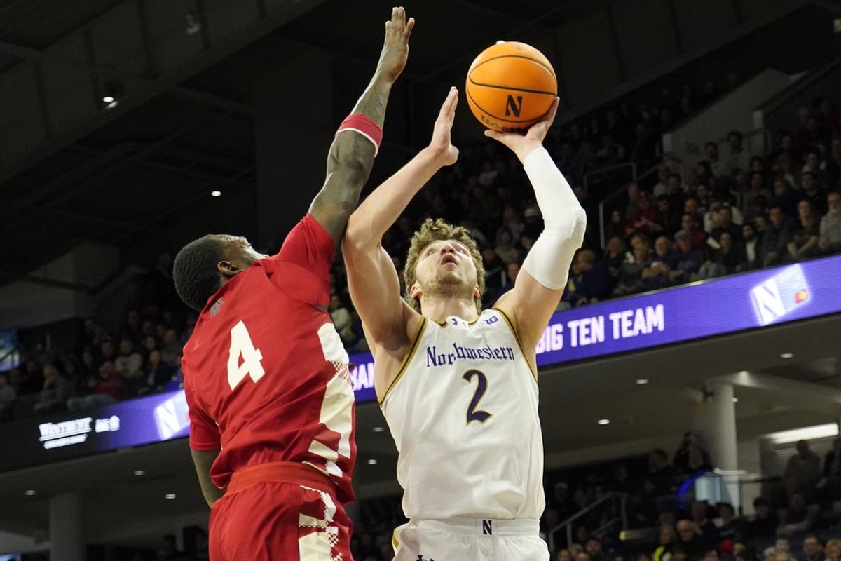 Feb 16, 2025; Evanston, Illinois, USA; Nebraska Cornhuskers forward Juwan Gary (4) defends Northwestern Wildcats forward Nick Martinelli (2) during the first half at Welsh-Ryan Arena. Mandatory Credit: David Banks-Imagn Images