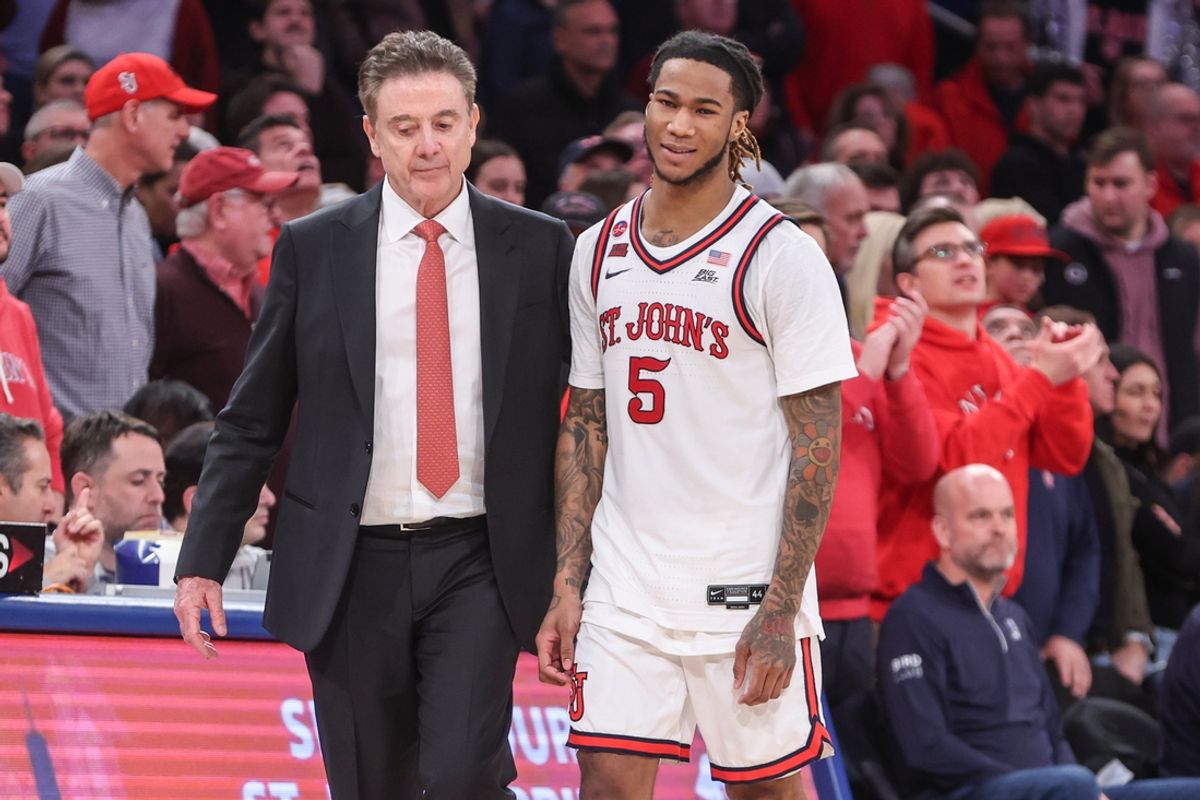 Feb 16, 2025; Queens, New York, USA;  St. John's Red Storm guard Deivon Smith (5) walks to the bench with head coach Rick Pitino in the second half against the Creighton Bluejays at Madison Square Garden. Mandatory Credit: Wendell Cruz-Imagn Images