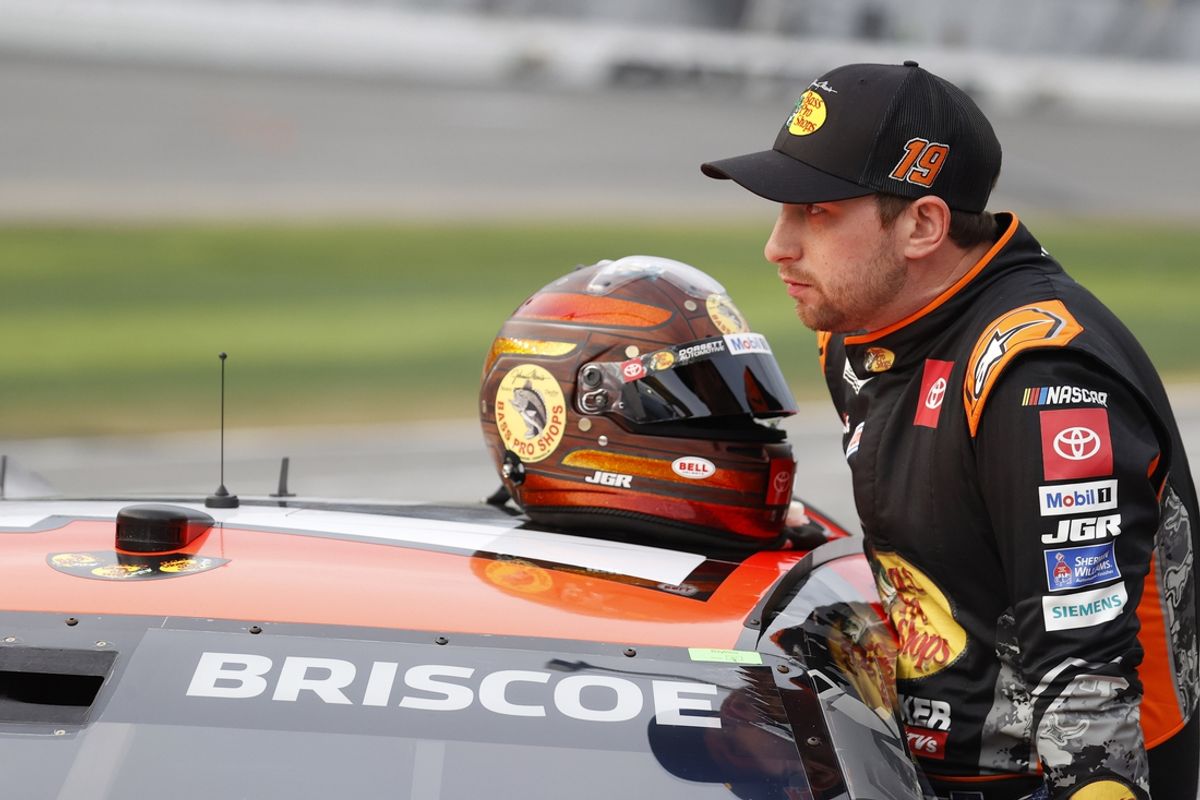 Feb 16, 2025; Daytona Beach, Florida, USA; NASCAR Cup Series driver Chase Briscoe (19) prepares to get in the car after a rain delay for the Daytona 500 at Daytona International Speedway. Mandatory Credit: Peter Casey-Imagn Images