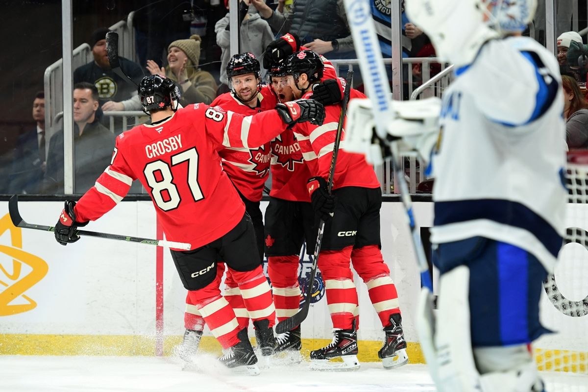 Feb 17, 2025; Boston, MA, USA; [Imagn Images direct customers only]  Team Canada forward Sidney Crosby (87) celebrates a goal by forward Nathan MacKinnon (29) during the first period in a 4 Nations Face-Off ice hockey game against Team Finland at TD Garden. Mandatory Credit: Bob DeChiara-Imagn Images