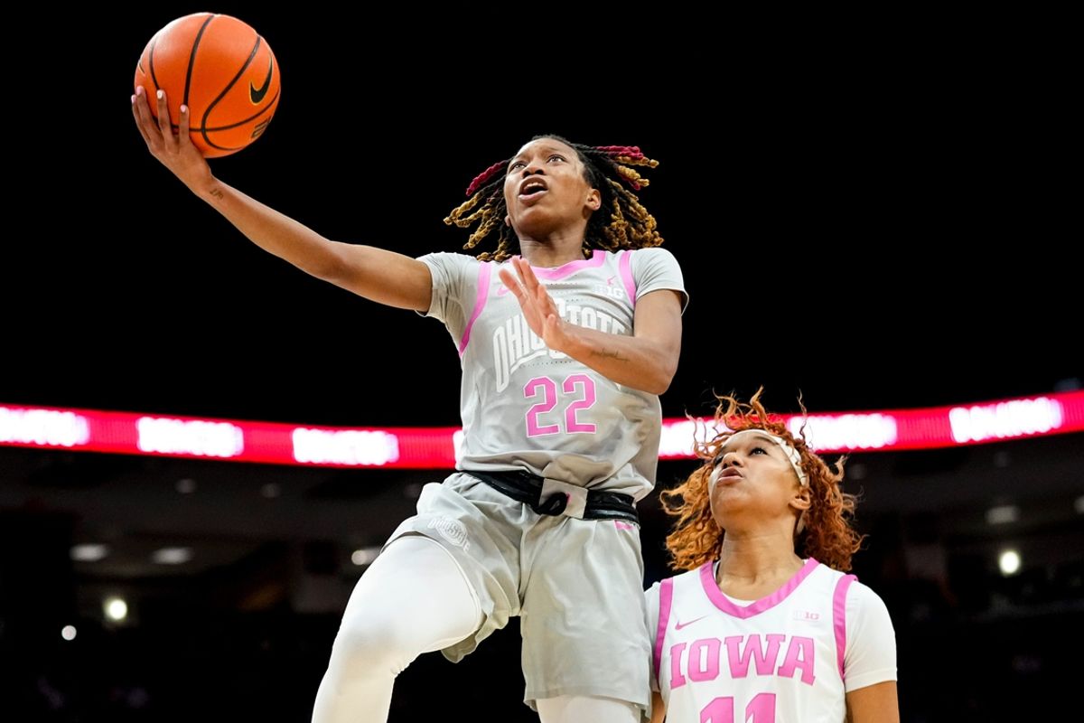 Ohio State Buckeyes guard Jaloni Cambridge (22) shoots a layup against Iowa Hawkeyes guard Aaliyah Guyton (11) in the first half at Value City Arena on Monday, Feb. 17, 2025 in Columbus, OH.