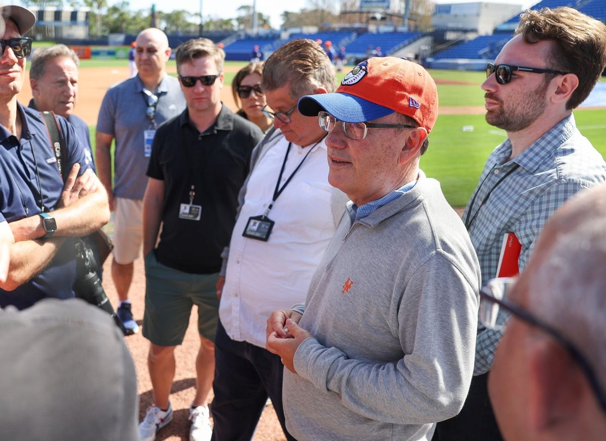 New York Mets owner Steve Cohen (second from right) talks with reporters during the first day of a full-squad workout during Spring Training at Clover Park on Monday, Feb. 17, 2025, in Port St. Lucie.