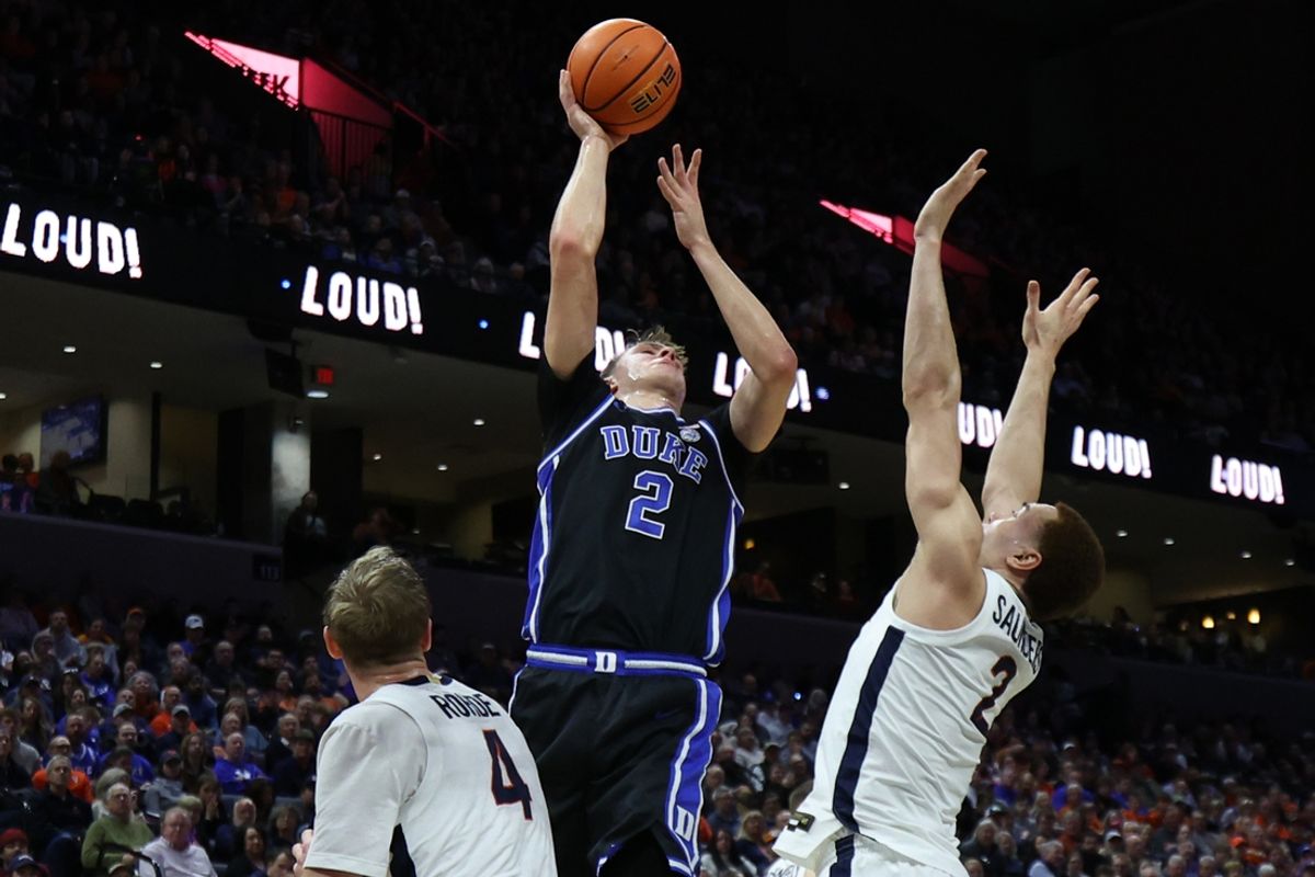 Feb 17, 2025; Charlottesville, Virginia, USA;  Duke Blue Devils guard Cooper Flagg (2) shoots the ball over Virginia Cavaliers forward Elijah Saunders (2) in the first half at John Paul Jones Arena. Mandatory Credit: Geoff Burke-Imagn Images