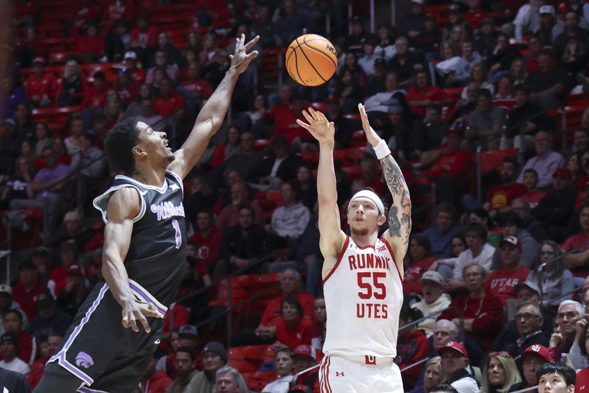 Feb 17, 2025; Salt Lake City, Utah, USA; Utah Utes guard Gabe Madsen (55) takes a three-point shot against Kansas State Wildcats guard David N'Guessan (1) during the second half at Jon M. Huntsman Center. Mandatory Credit: Rob Gray-Imagn Images